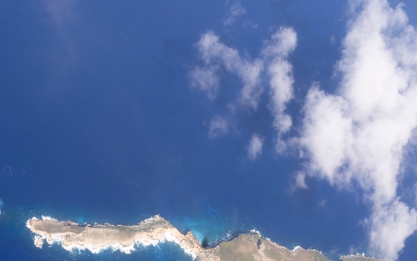 Marine F/A-18s fly over the Pacific