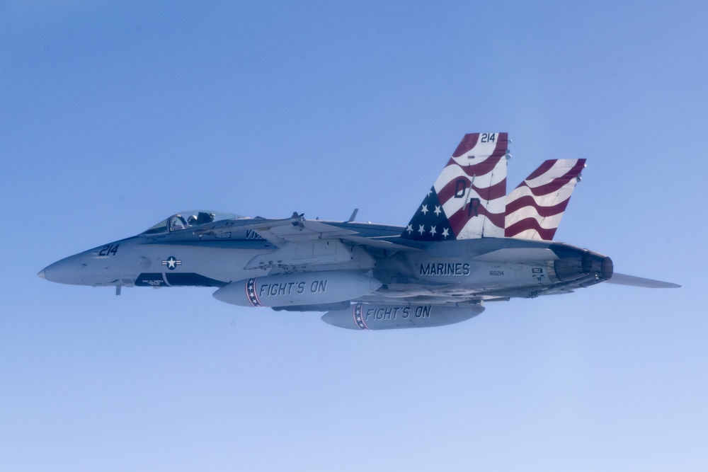 Marine F/A-18s fly over the Pacific