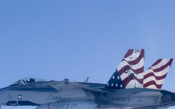 Marine F/A-18s fly over the Pacific