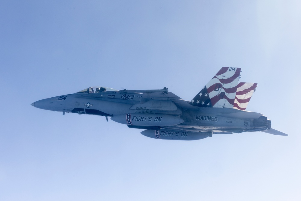 Marine F/A-18s fly over the Pacific