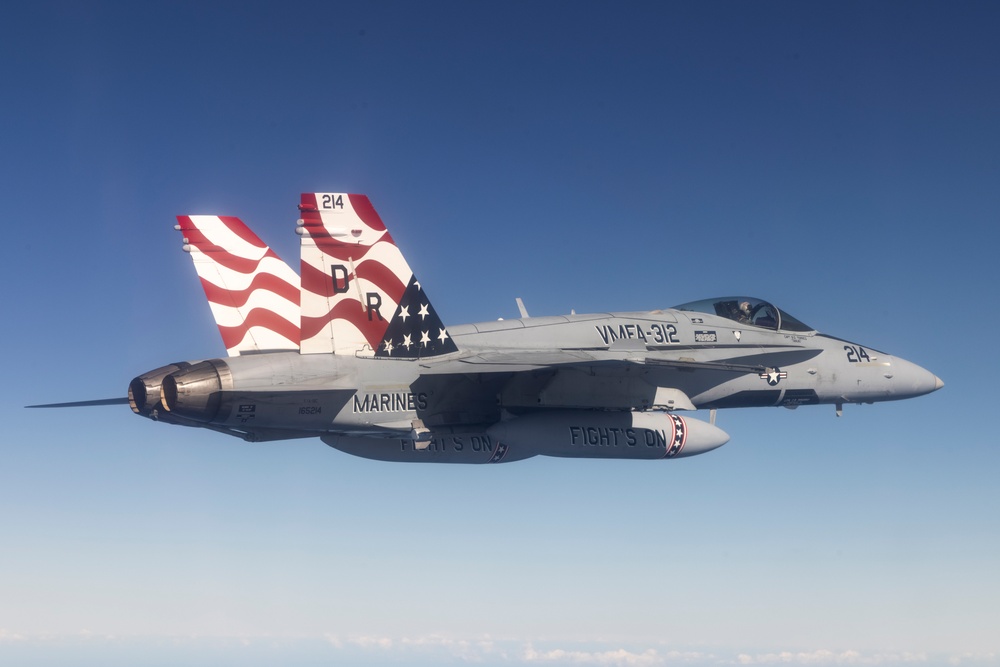 Marine F/A-18s fly over the Pacific