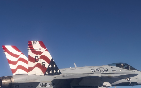 Marine F/A-18s fly over the Pacific