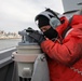 Sailor stands watch on bridge