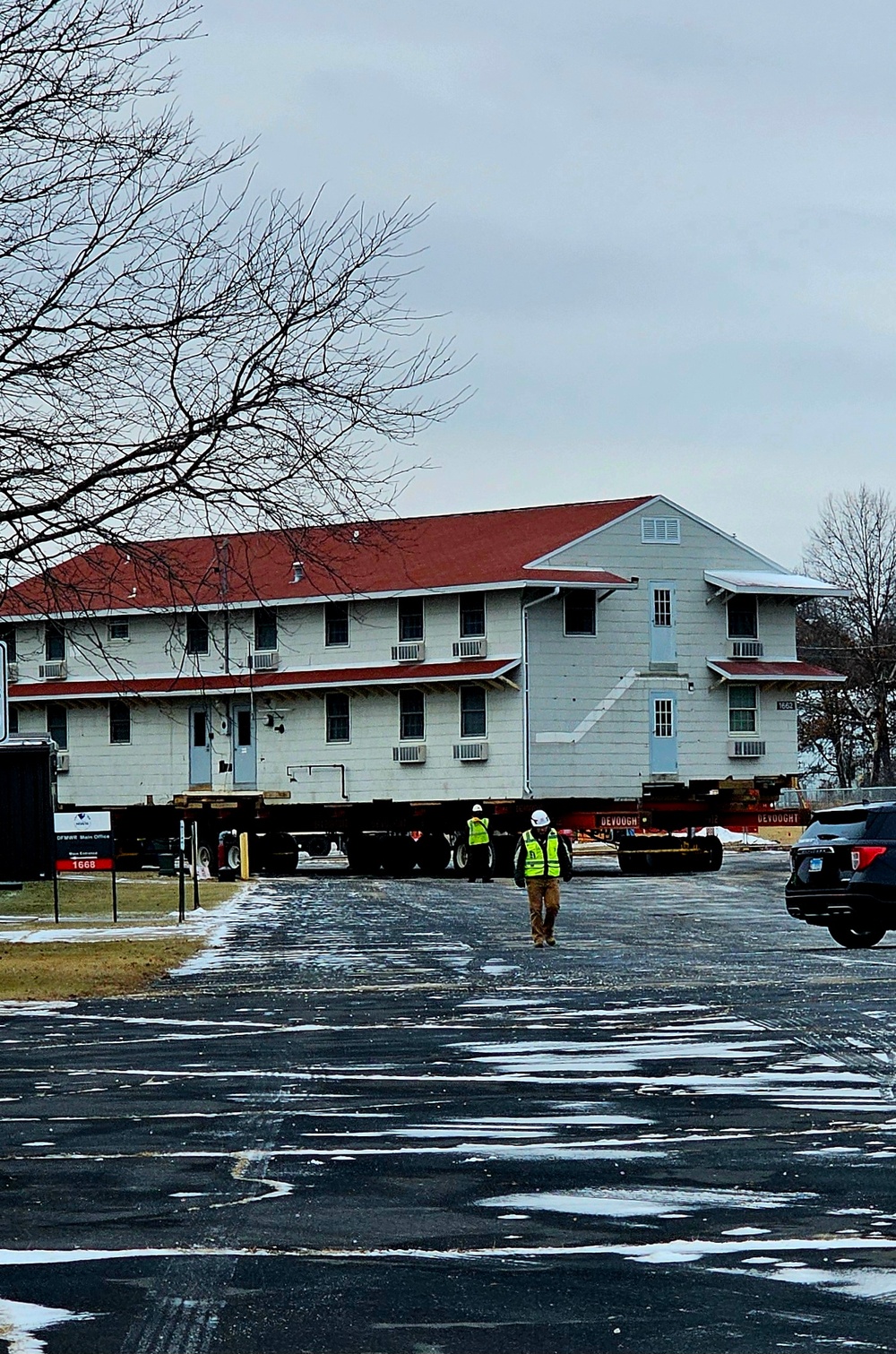 Contractors move first of five World War II-era barracks in 2025