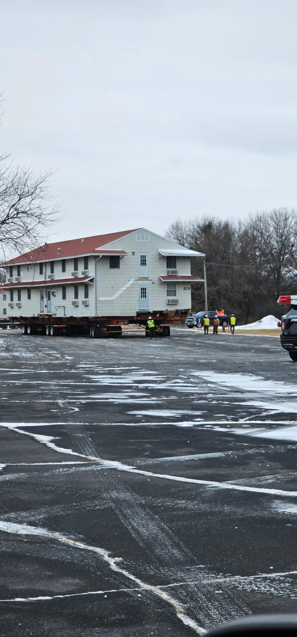 Contractors move first of five World War II-era barracks in 2025