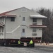 Contractors move first of five World War II-era barracks in 2025