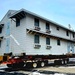 Contractors move first of five World War II-era barracks in 2025