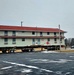 Contractors move first of five World War II-era barracks in 2025