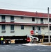 Contractors move first of five World War II-era barracks in 2025