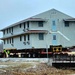 Contractors move first of five World War II-era barracks in 2025