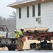 Contractors move first of five World War II-era barracks in 2025