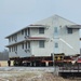 Contractors move first of five World War II-era barracks in 2025