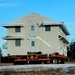 Contractors move first of five World War II-era barracks in 2025