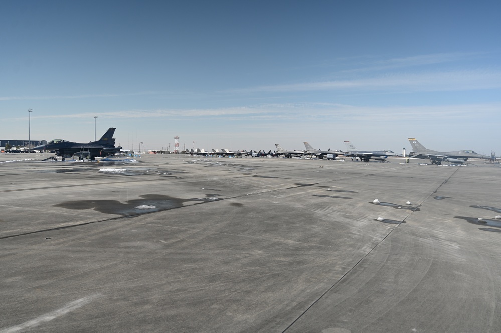 Clearing snow off the flightline