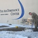 Clearing snow off the flightline