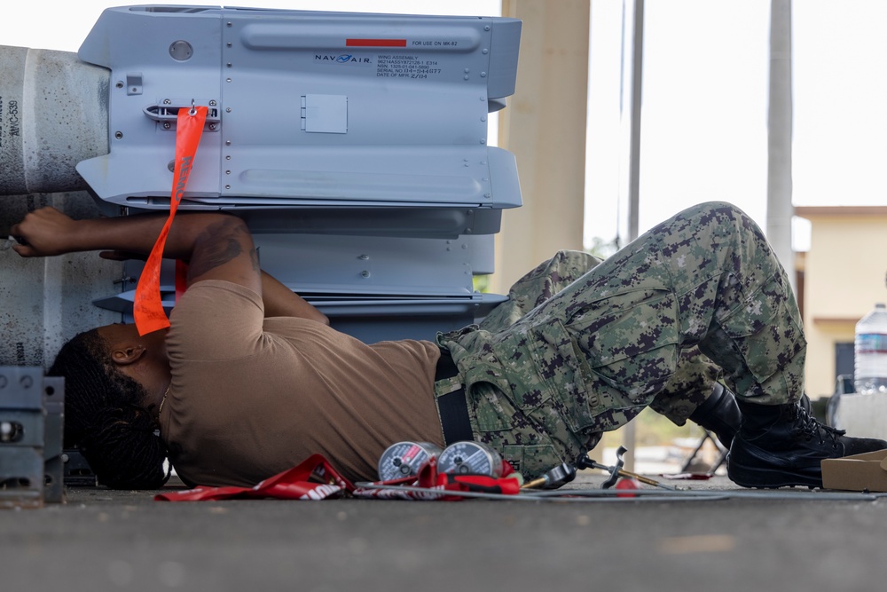 U.S. Marines and Sailors build ordnance in Guam