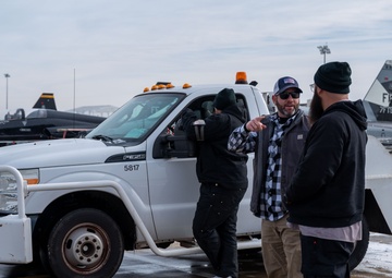 Breaking the Ice: Airmen remove snow, resume flying ops
