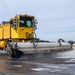 Breaking the Ice: Airmen remove snow, resume flying ops