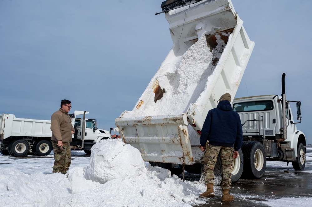 Breaking the Ice: Airmen remove snow, resume flying ops