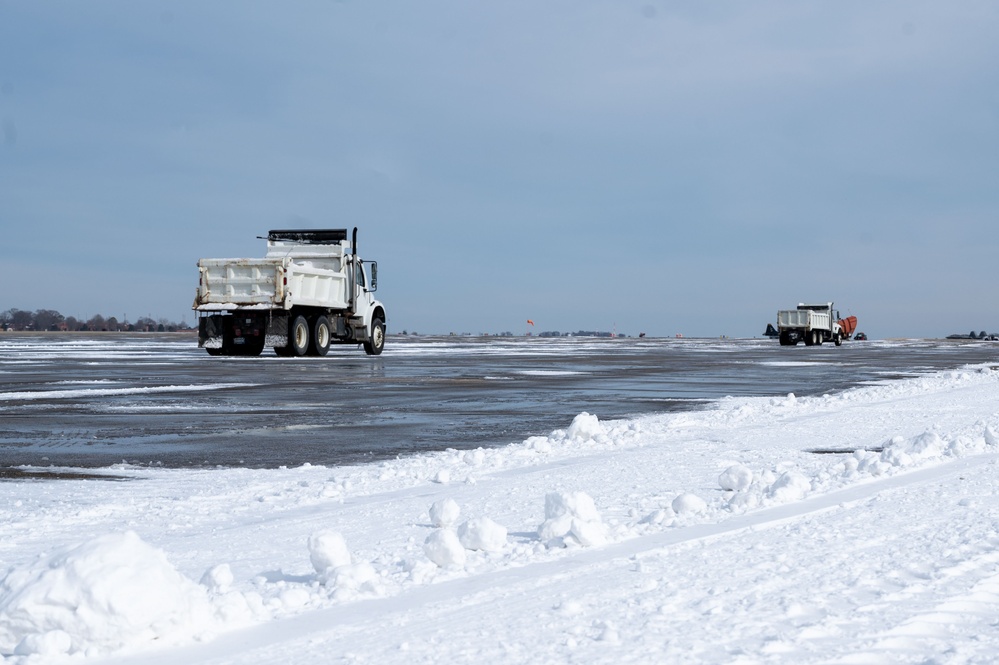 Breaking the Ice: Airmen remove snow, resume flying ops