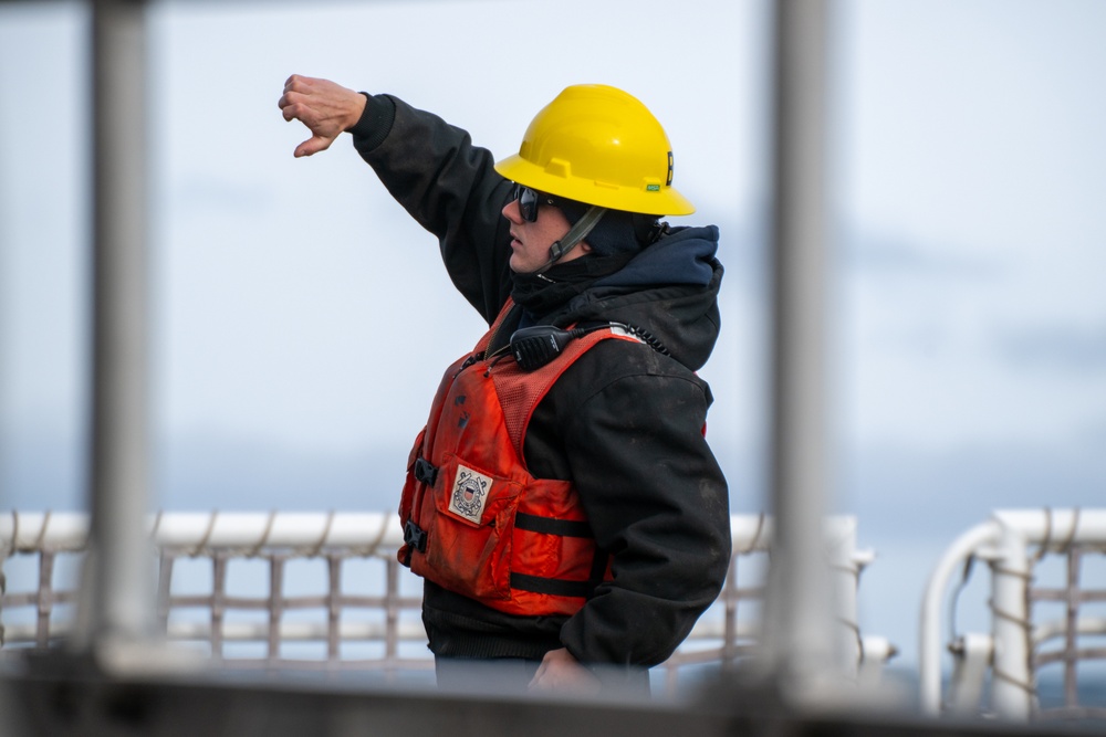 USCGC Polar Star (WAGB 10) conducts crane operations in McMurdo Sound during Operation Deep Freeze