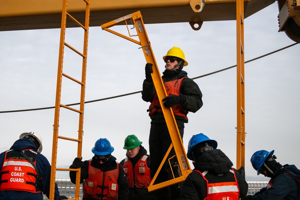 USCGC Polar Star (WAGB 10) conducts crane operations in McMurdo Sound during Operation Deep Freeze