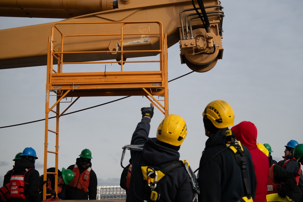 USCGC Polar Star (WAGB 10) conducts crane operations in McMurdo Sound during Operation Deep Freeze
