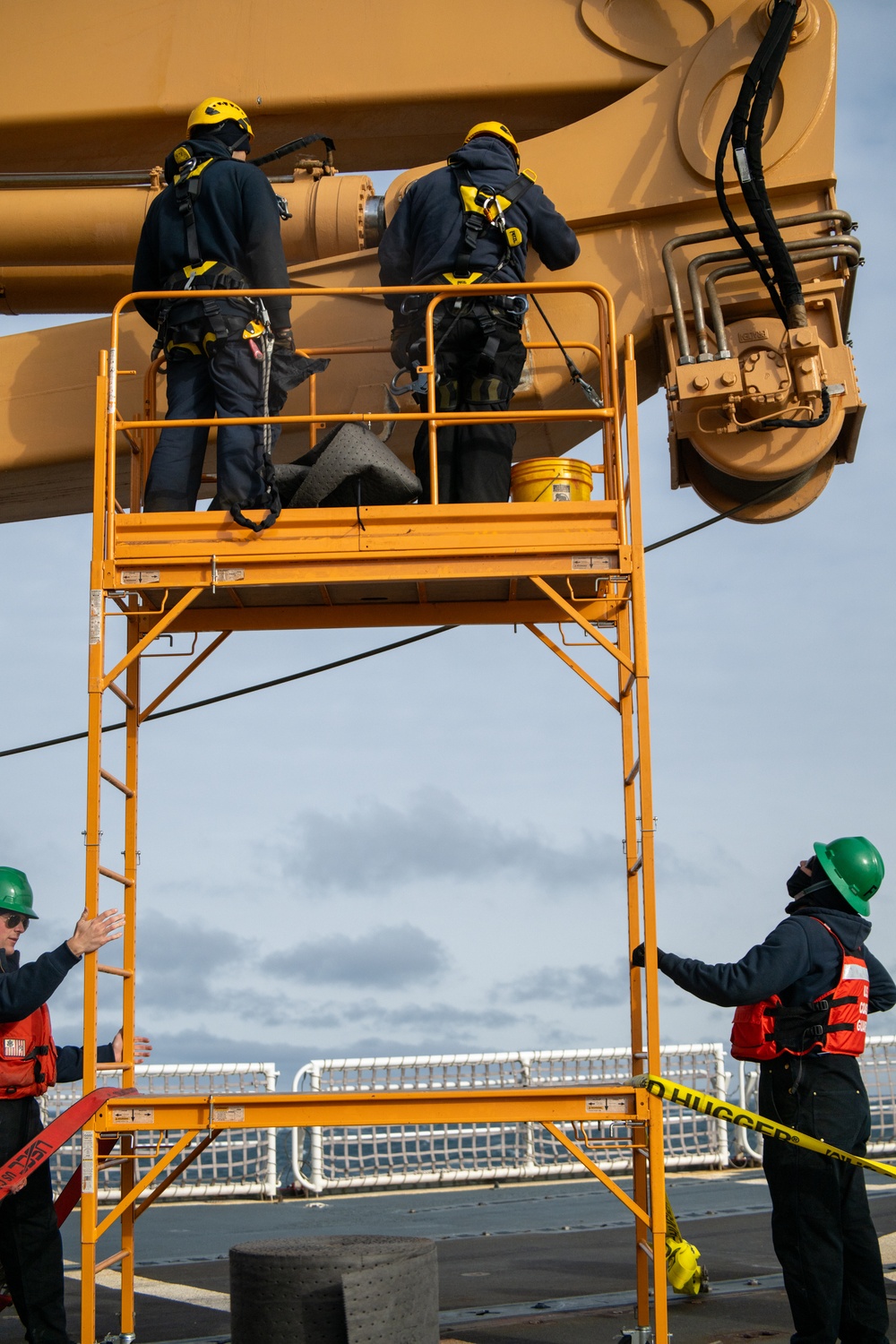 USCGC Polar Star (WAGB 10) conducts crane operations in McMurdo Sound during Operation Deep Freeze