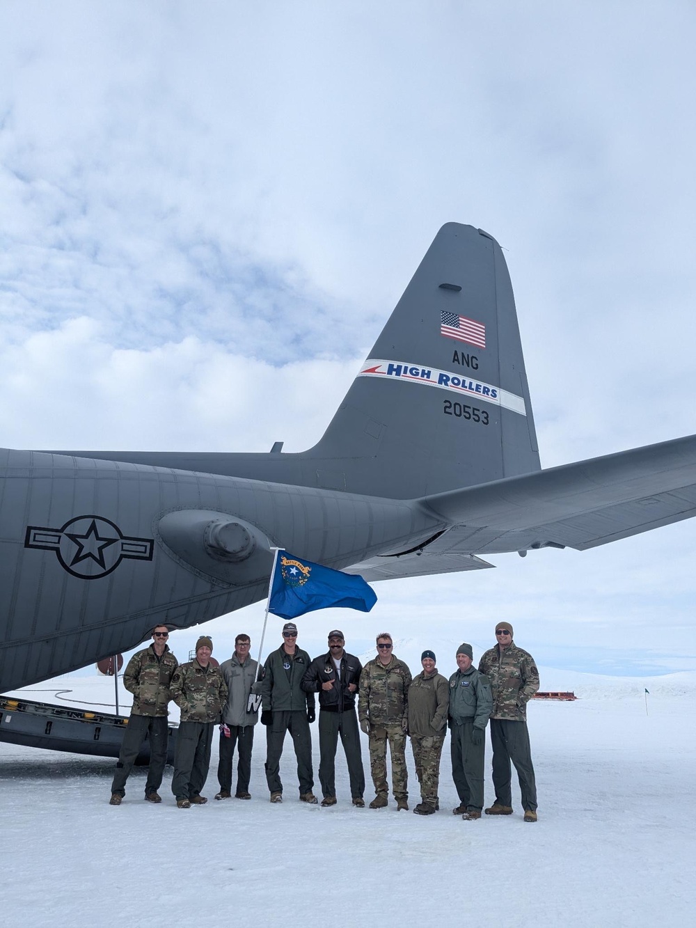 152nd Airlift Wing crew poses with Aircraft 553 on their first ever mission assisting with Operation Deep Freeze in Antarctica