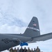 152nd Airlift Wing crew poses with Aircraft 553 on their first ever mission assisting with Operation Deep Freeze in Antarctica