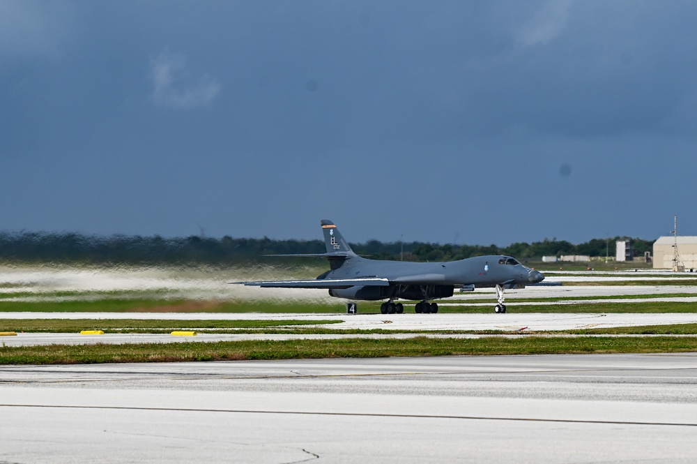 A pair of 34th Expeditionary Bomb Squadron B-1B Lancers perform dual runway takeoff at Andersen Air Force Base during BTF 25-1