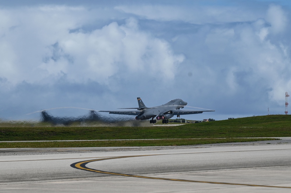 A pair of 34th Expeditionary Bomb Squadron B-1B Lancers perform dual runway takeoff at Andersen Air Force Base during BTF 25-1