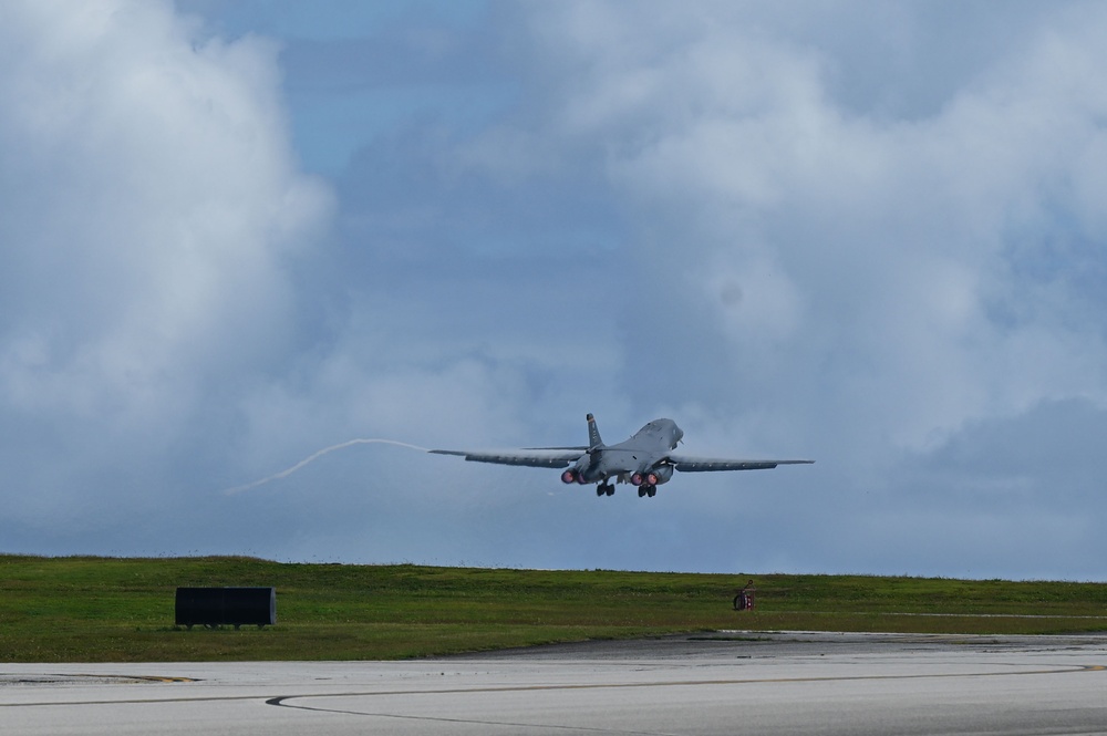 A pair of 34th Expeditionary Bomb Squadron B-1B Lancers perform dual runway takeoff at Andersen Air Force Base during BTF 25-1