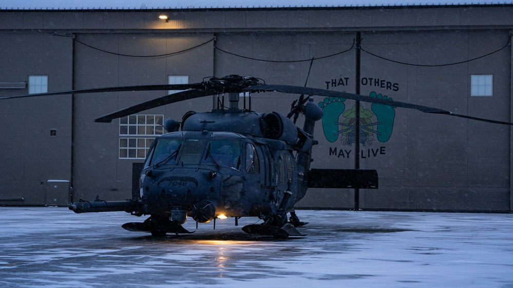 An Alaska Air National Guard HH-60G Pave Hawk helicopter departs Eielson AFB, AK on a routine training flight.