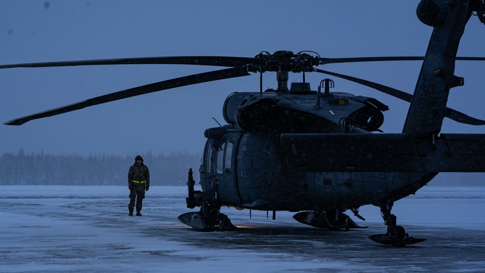 An Alaska Air National Guard HH-60G Pave Hawk helicopter departs Eielson AFB, AK on a routine training flight.