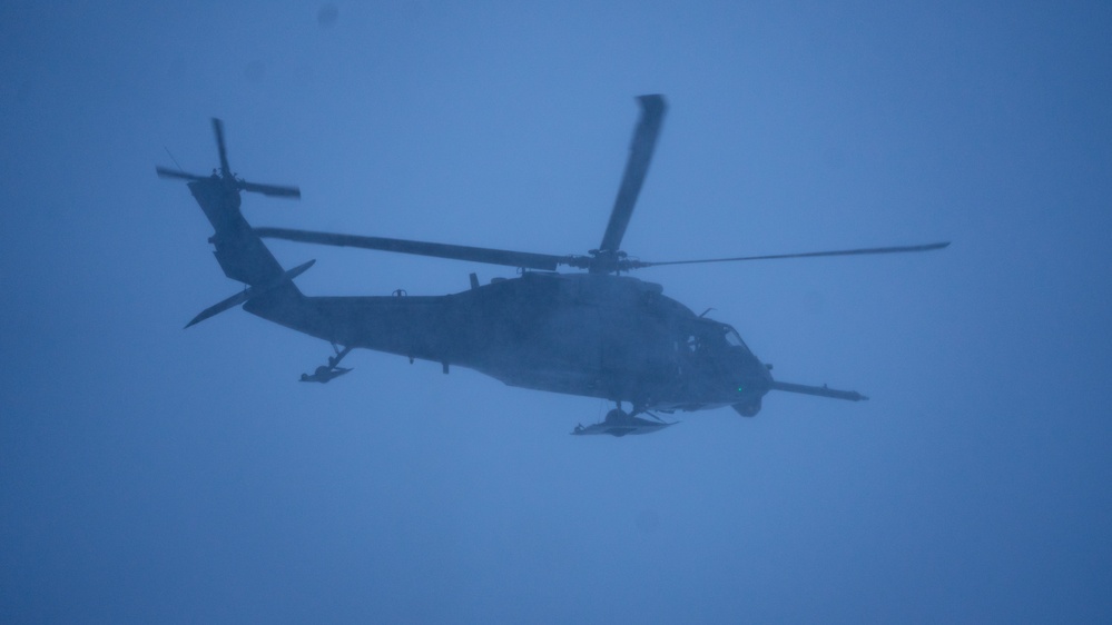 An Alaska Air National Guard HH-60G Pave Hawk helicopter departs Eielson AFB, AK on a routine training flight.