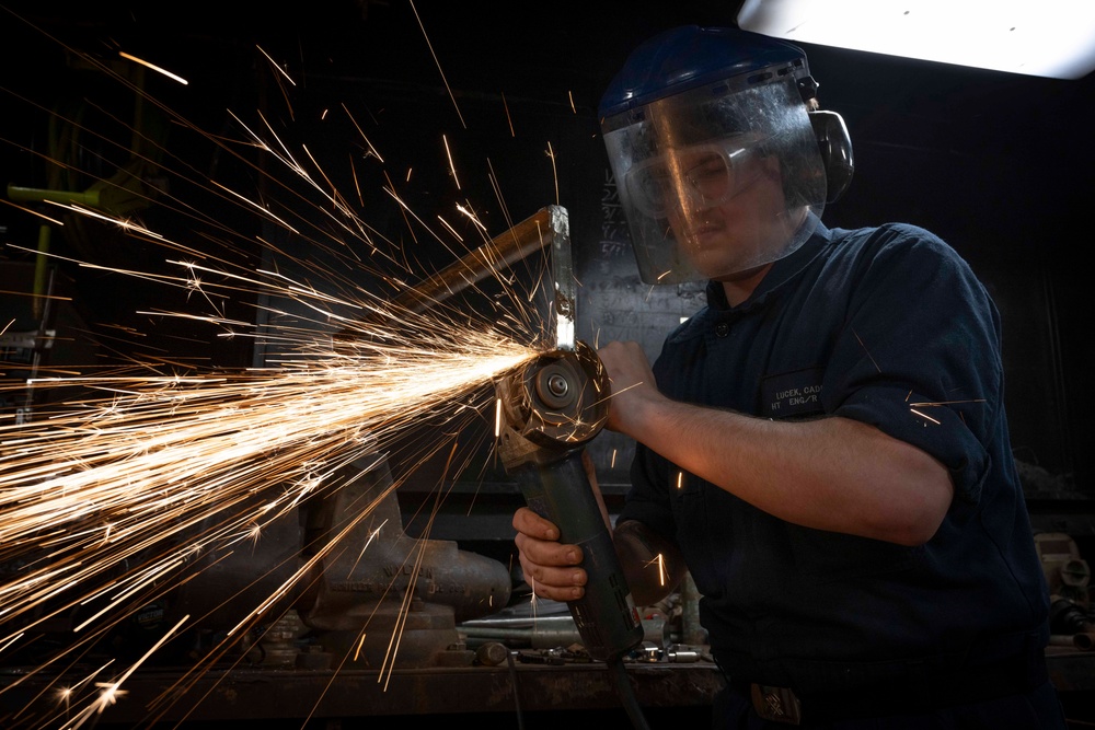 Nimitz Sailor Grinds Down Scrap Metal