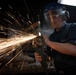 Nimitz Sailor Grinds Down Scrap Metal