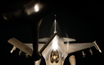 F-16 Fighting Falcons join KC-135 Stratotanker for aerial refueling over USCENTCOM at night