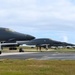 A pair of 34th Expeditionary Bomb Squadron B-1B Lancers perform dual runway takeoff at Andersen Air Force Base during BTF 25-1