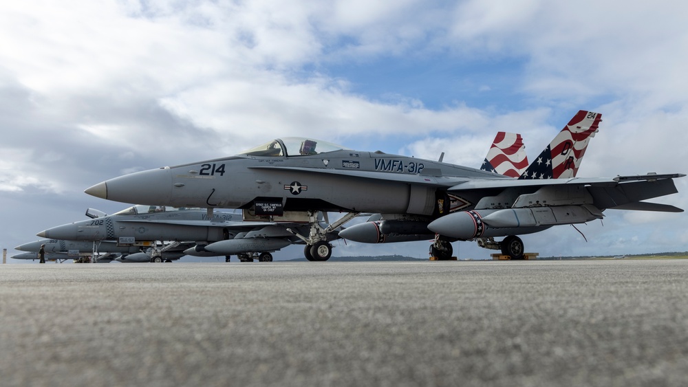 Marine F/A-18 loads Air Force missile in Guam