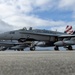 Marine F/A-18 loads Air Force missile in Guam