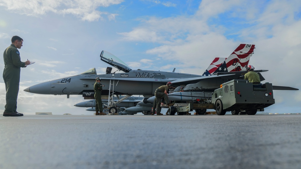 Marine F/A-18 loads Air Force missile in Guam