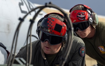 Marine F/A-18 loads Air Force missile in Guam