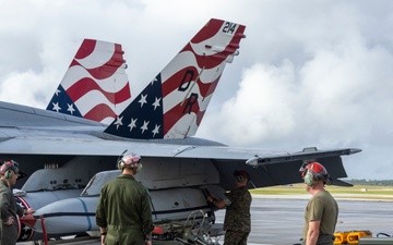 Marine F/A-18 loads Air Force missile in Guam