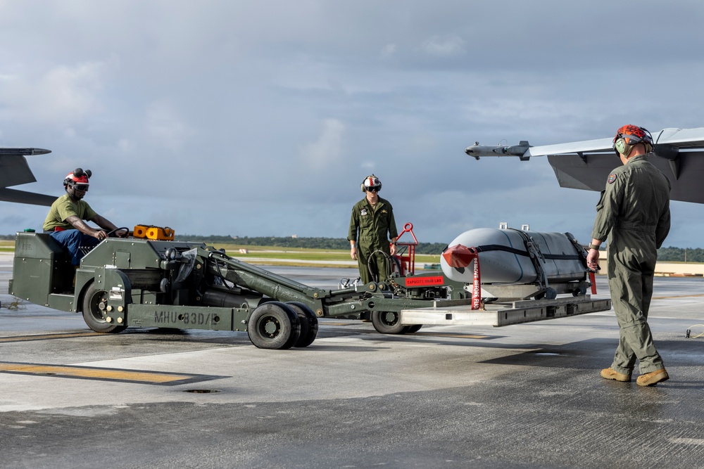 Marine F/A-18 loads Air Force missile in Guam