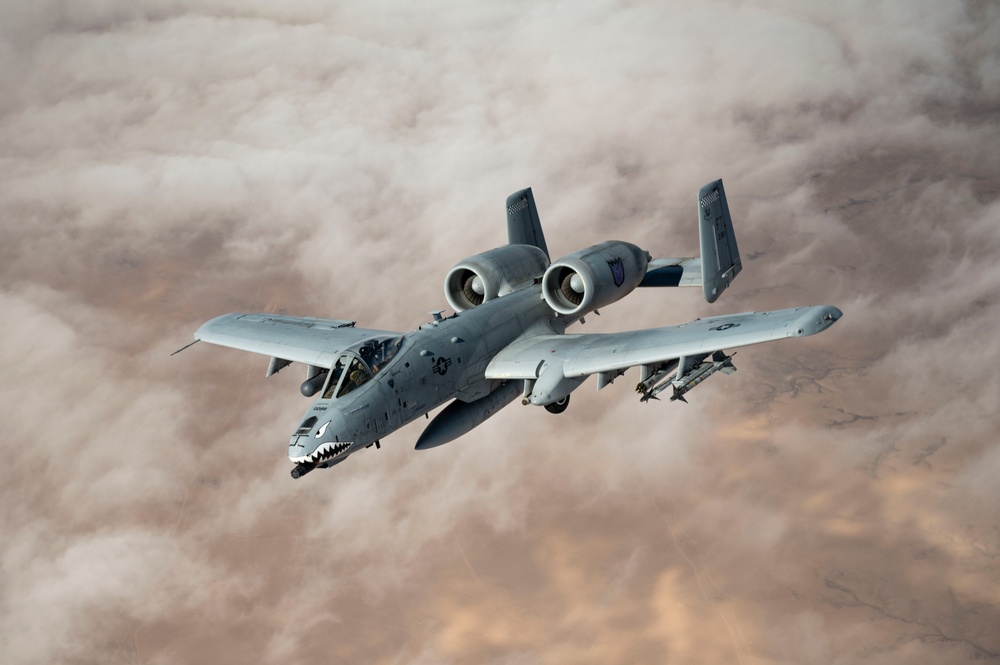 Fighters fly over cloudy skies