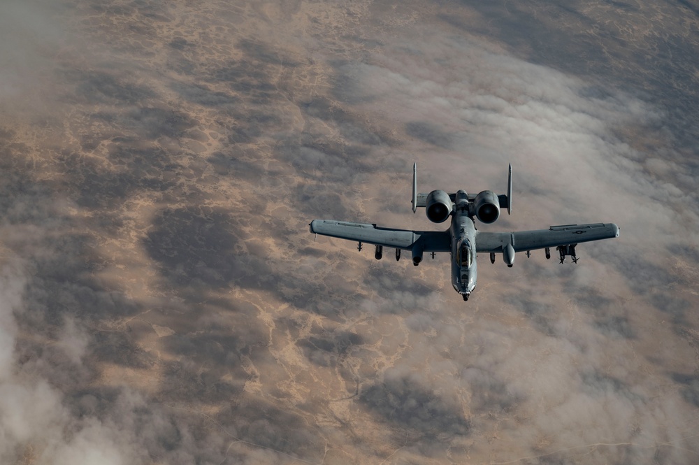 Fighters fly over cloudy skies