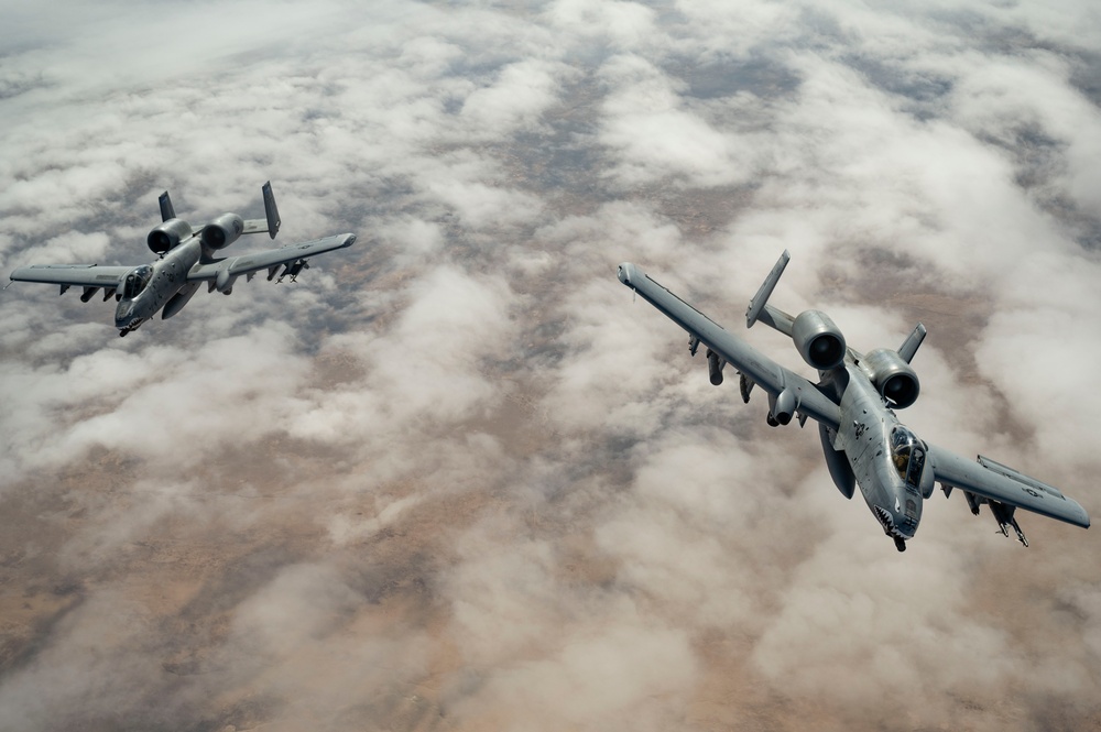 Fighters fly over cloudy skies