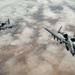 Fighters fly over cloudy skies